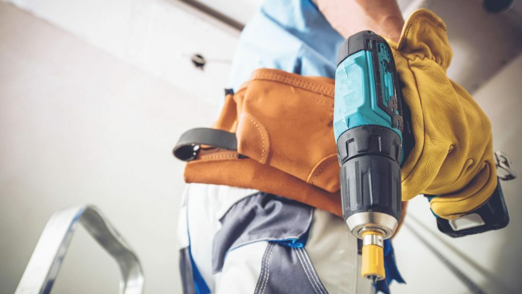 Garage Door Tech in Richmond, TX providing repair service on a residential garage door